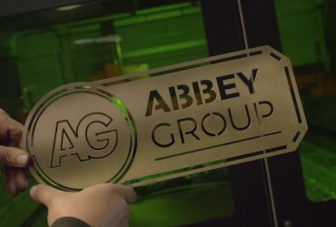 Abbey Group Logo laser cut into metal